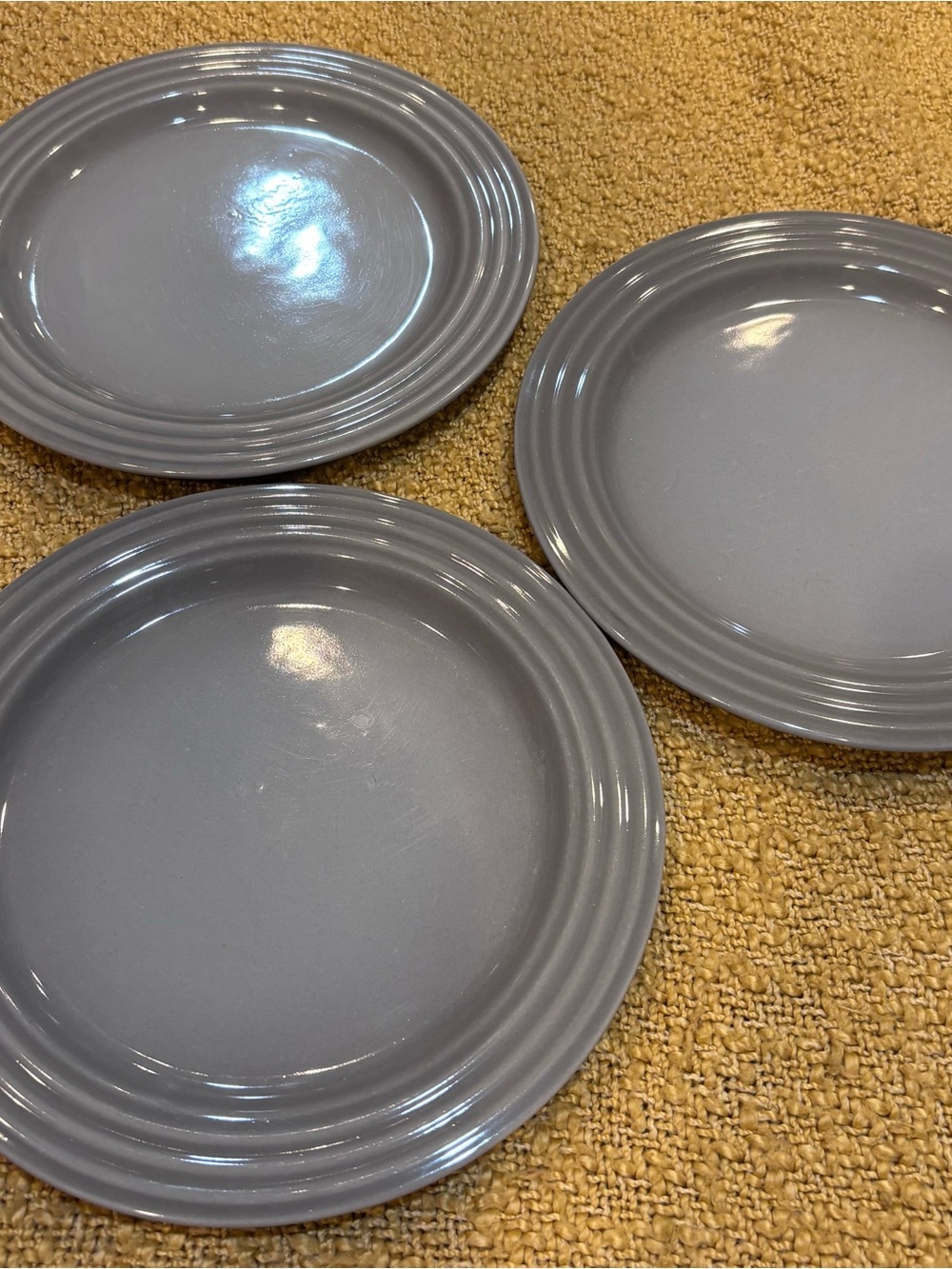 3 Le Creuset 8.5 inch plates. Gray. Great used condition.